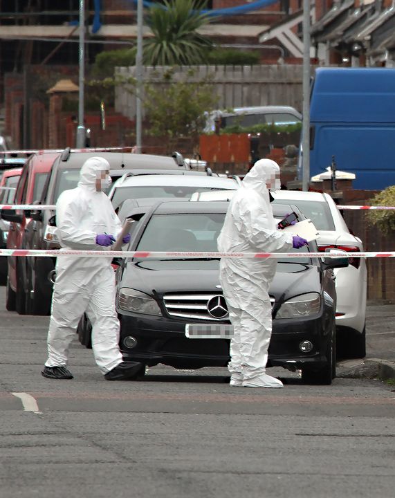 Police at the scene of Robbie Lawlor's murder in Belfast in April 2020
